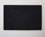 blank black canvas hanging on a cream wall