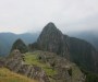 The ruins of Machu Picchu seen from above with the mountain of Huayna Picchu in the background