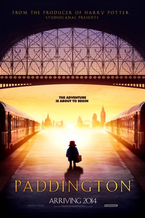 poster for upcoming Paddington Bear movie, featuring a silhouette of the bear in question standing on a train platform. Caption reads: The Adventure is about to begin. Arriving 2014