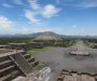 View from the top of the temple of the moon pyramid at Teotihuacán, along the Avenue of the dead, including the temple of the sun to the left and multiple small structures in the foreground