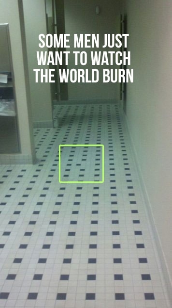 A tiled bathroom floor where most of the tiles are white but there are neat rows of black ones. Except in one spot which has been highlighted where the black tile is placed one space over, out of alignment with its fellows. Caption reads: Some men just want to watch the world burn.