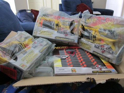 Array of just unboxed Nerf Mavrick guns and ammo
