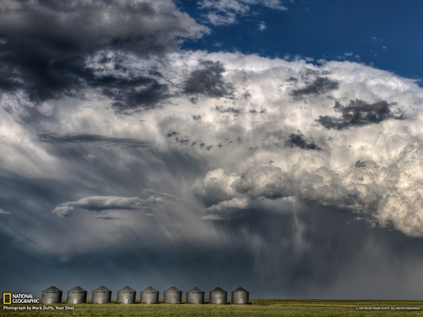 A major thunderhead masses near Briercrest, Saskatchewan, in August 2011. Dramatic and beautiful clouds form above a field.