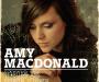 Album Cover for Amy MacDonald's "This is the Life" showing the artist holding a guitar.