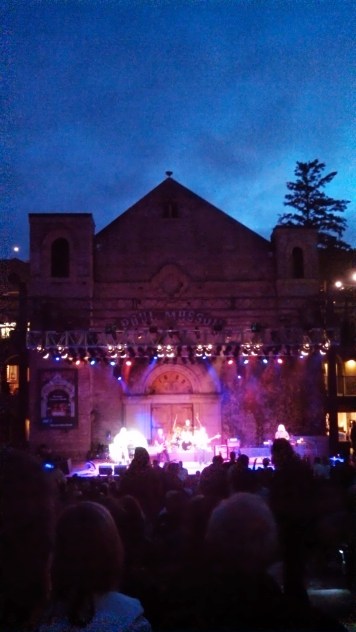 CCR rock out on stage at dusk