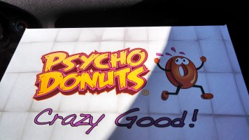 Psycho Donuts box, featuring a terrified appearing donut running away and the caption: Crazy Good!