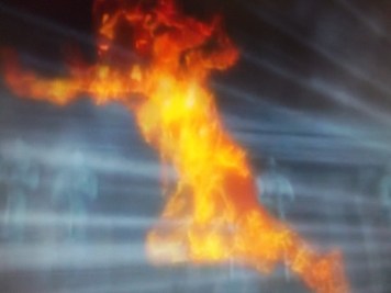 The shape of a running person made out of fire