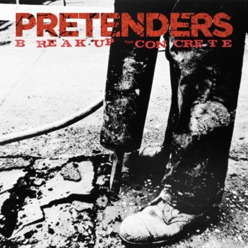 Album cover of The Pretenders' 'Break Up the Concrete'. A photo of someone from the knees down with dirty trousers and shoes directing a road drill into the ground and, well, breaking the concrete.