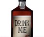 Classical bottle of ten year old whiskey. The label reads in slightly uneven letters: DRINK ME